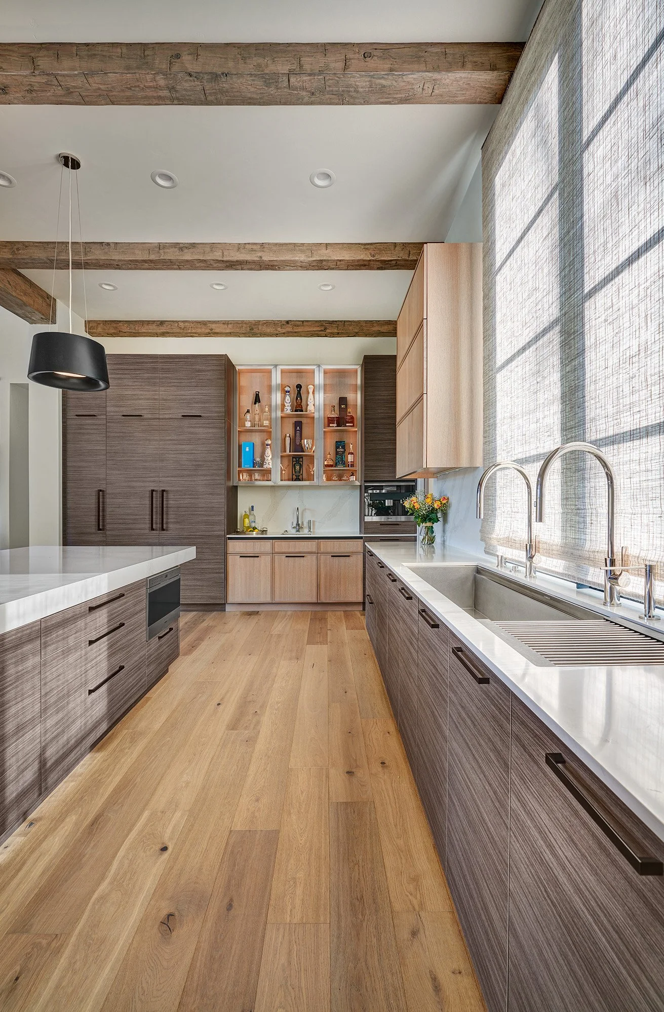 Modern new construction home, kitchen, large seating island, tall appliance wall, laminate and white oak cabinetry, The Galley workstation