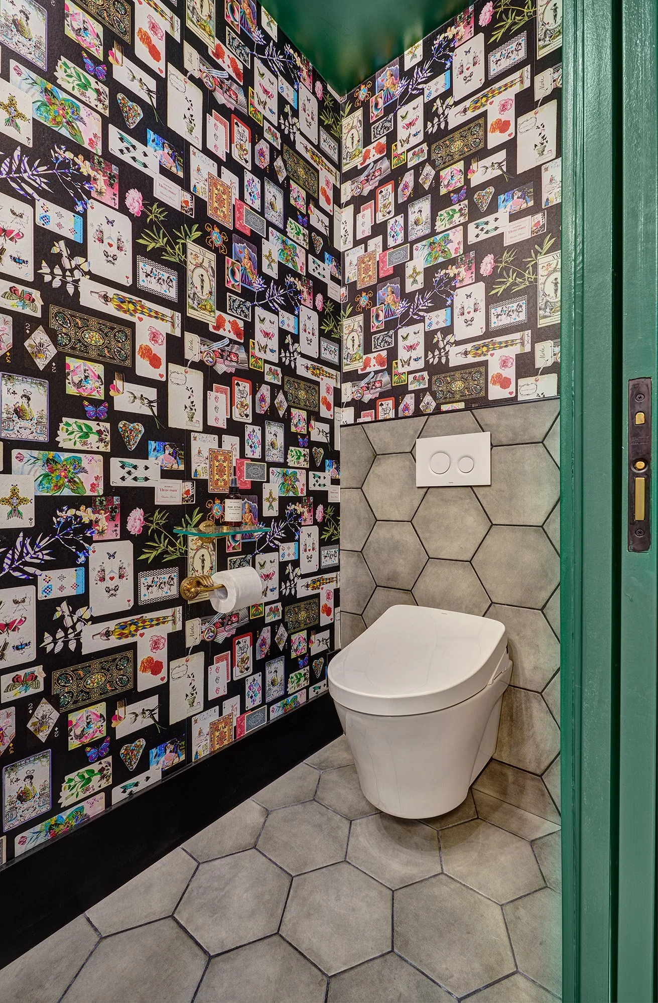 Green powder bath, card wallpaper, wall hung toilet, hex tile, white oak cabinet vanity
