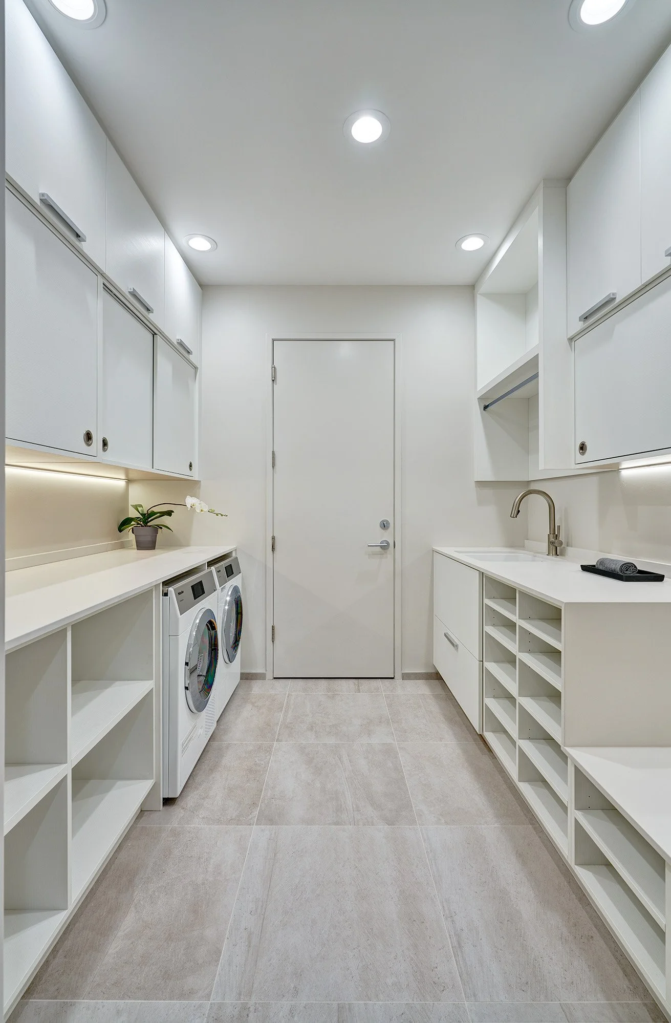 Modern whole home remodel, European cabinetry laundry room, open storage