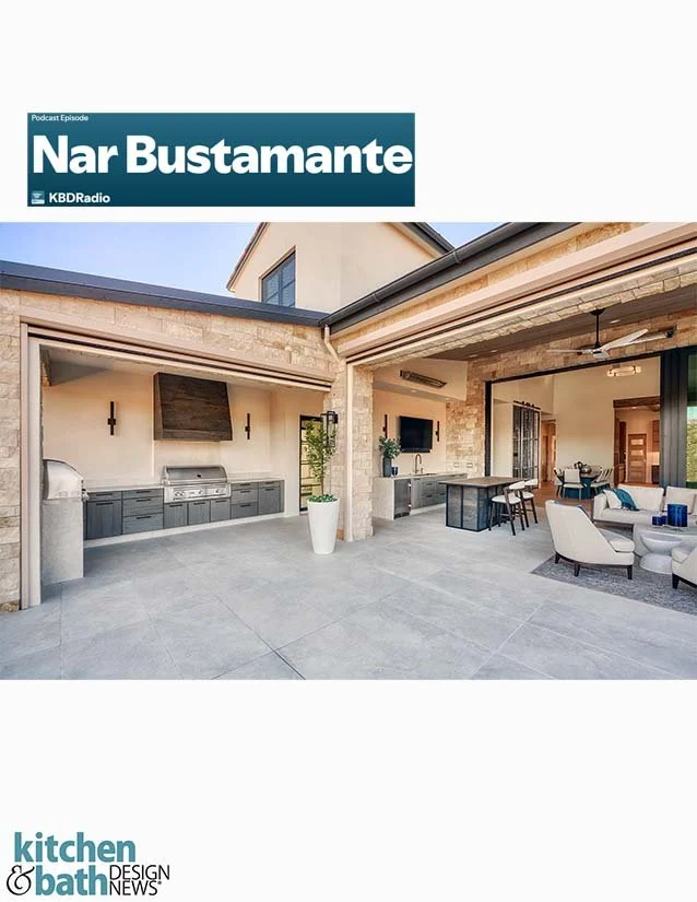 Outdoor kitchen and living space with built-in grill, TV, and seating in a modern patio.