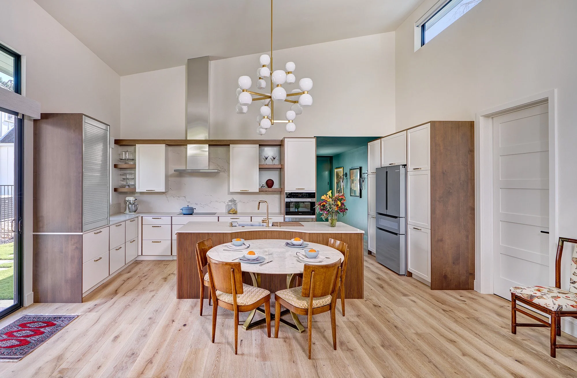 New construction ADU home, white + wood kitchen, curved ribbed island, appliance garage