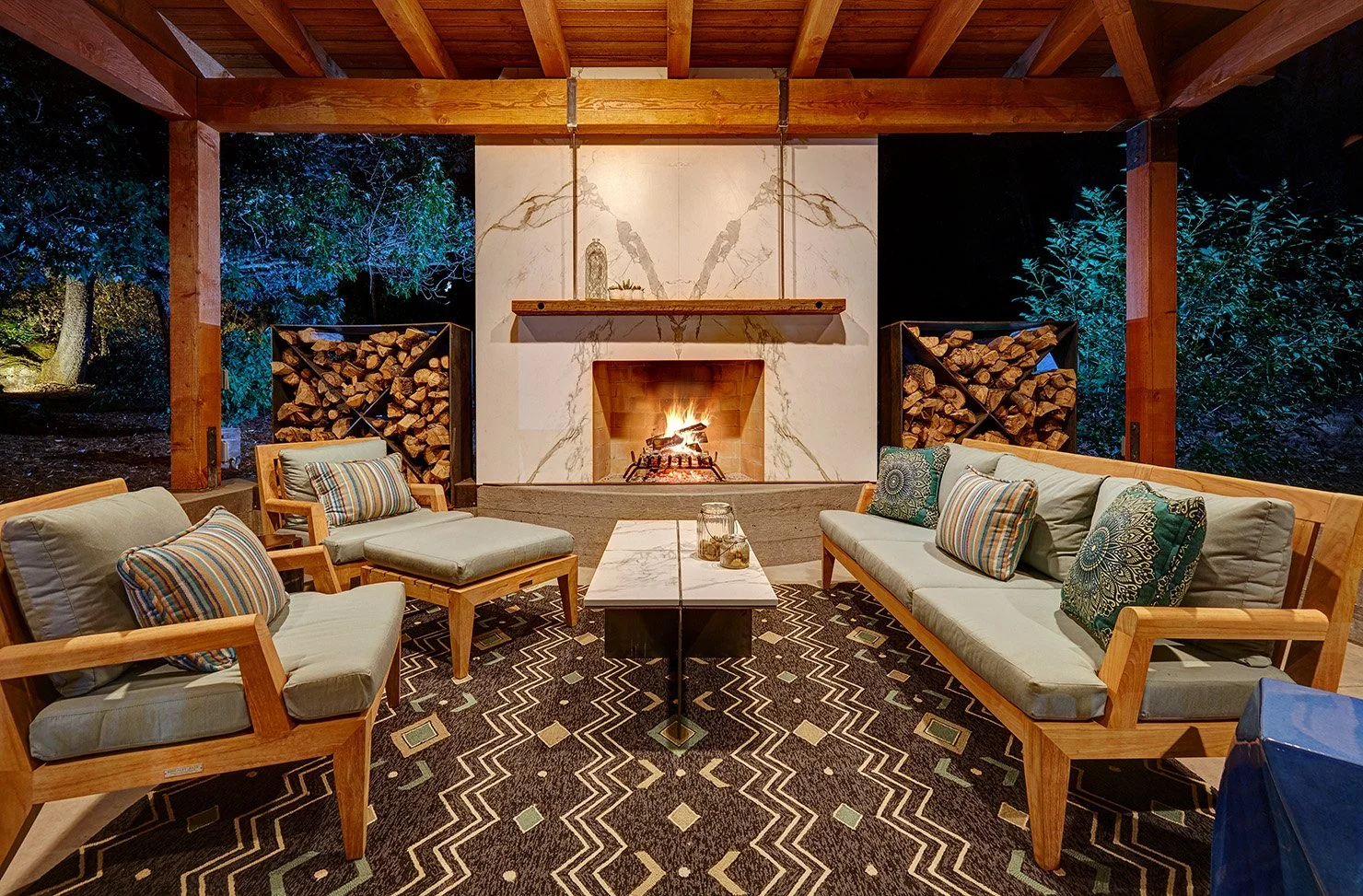 Whole home remodel, modern industrial outdoor lounge with Dekton clad fireplace