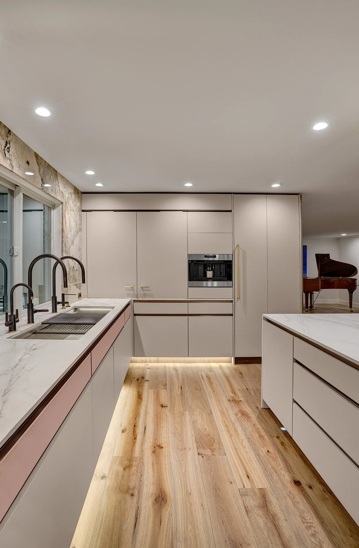 Modern kitchen remodel, blush glass drawer fronts, channel hardware, coplanar cabinet doors