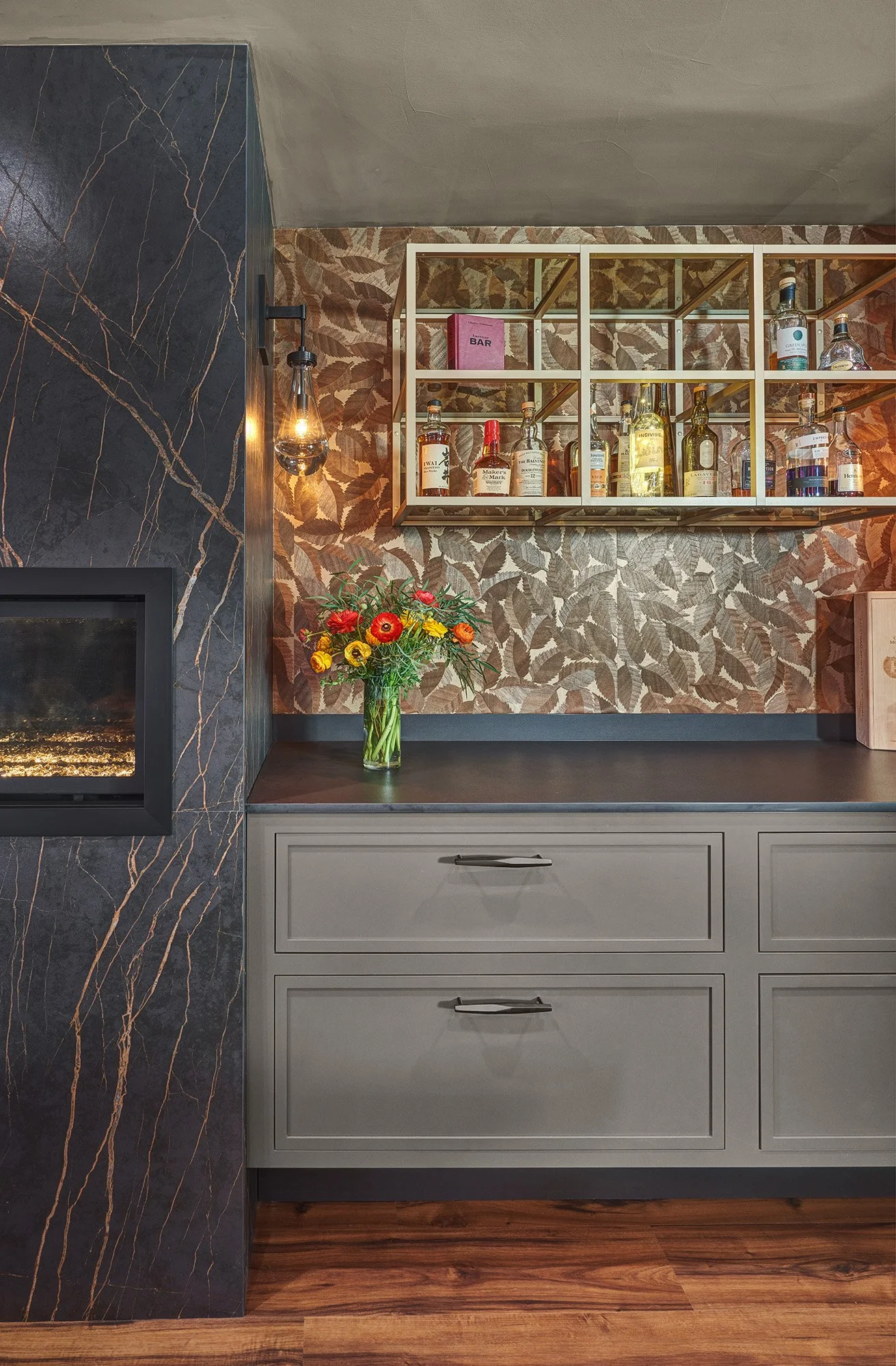 Remodeled dining room, European cabinetry, glass front internally lit display cabinet, paneled wine refrigerator, linear fireplace