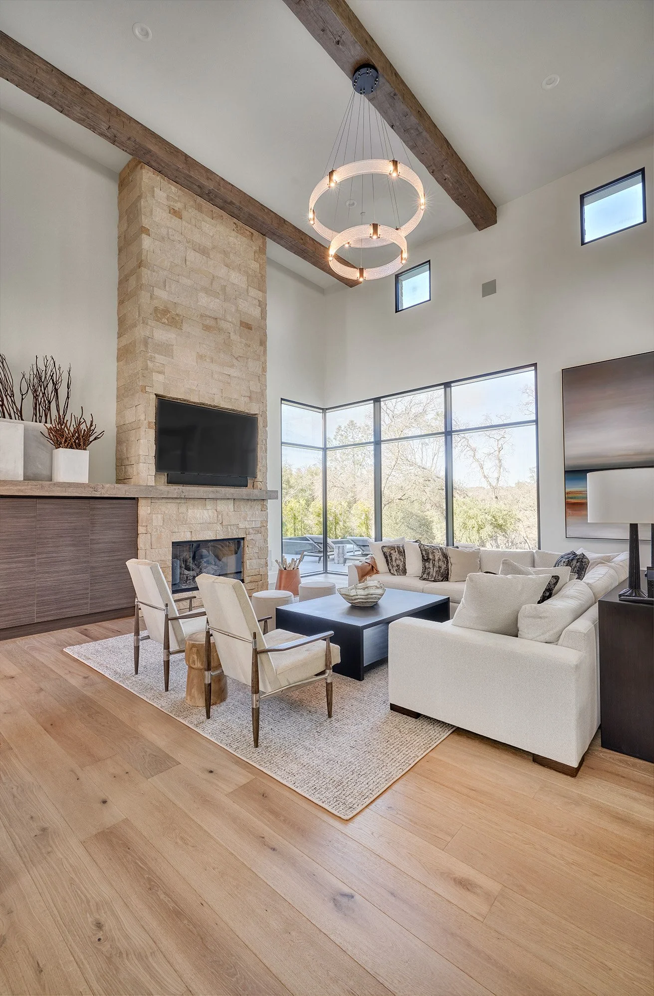 Modern new construction home, full heigh fireplace, tall ceilings, beams
