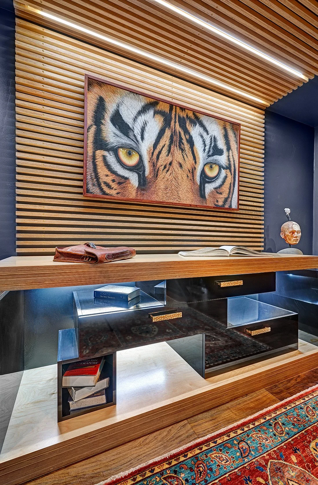 Moody office, gloss black cabinetry, slatted wall treatment, desk