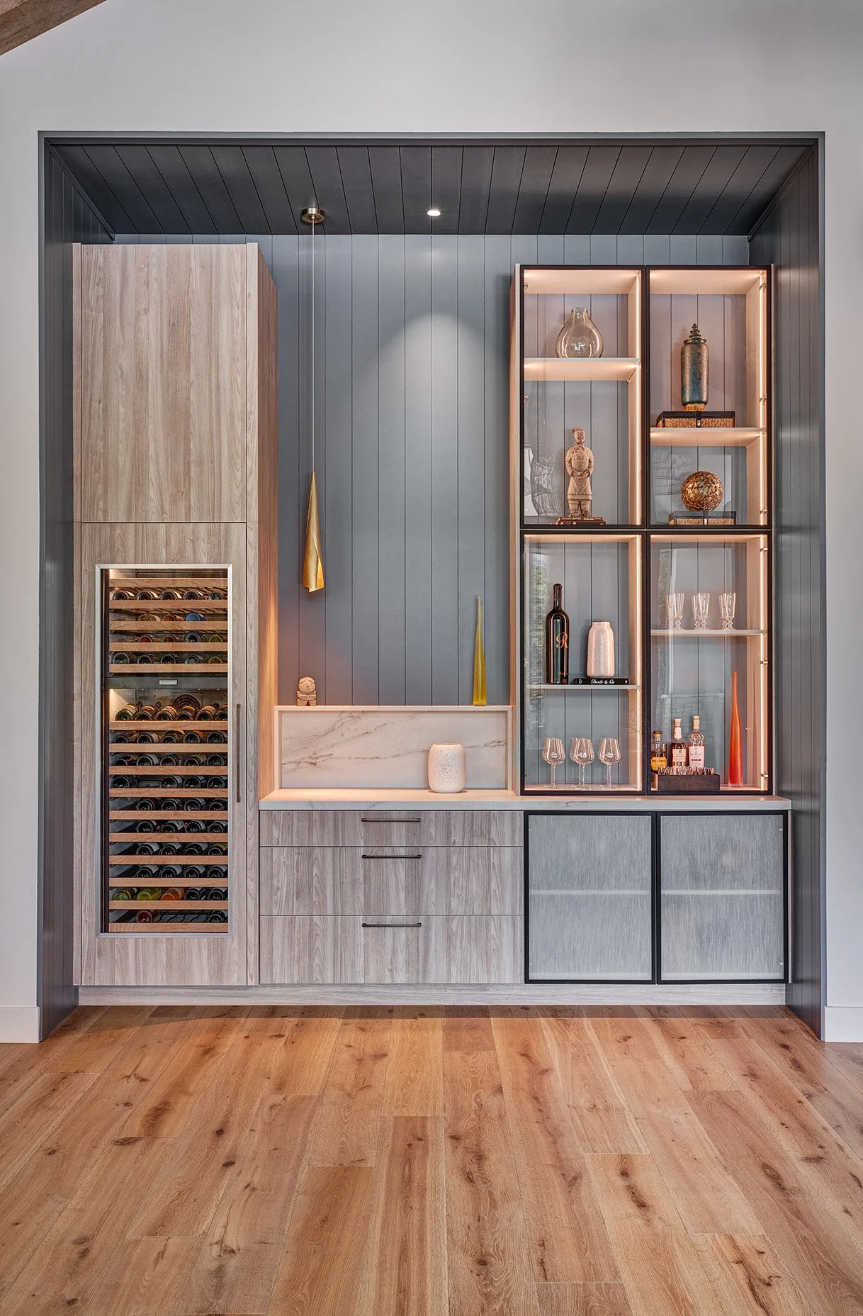Warm modern new construction home, moody bar, European cabinetry, kerf cut panel splash, wine refrigerator