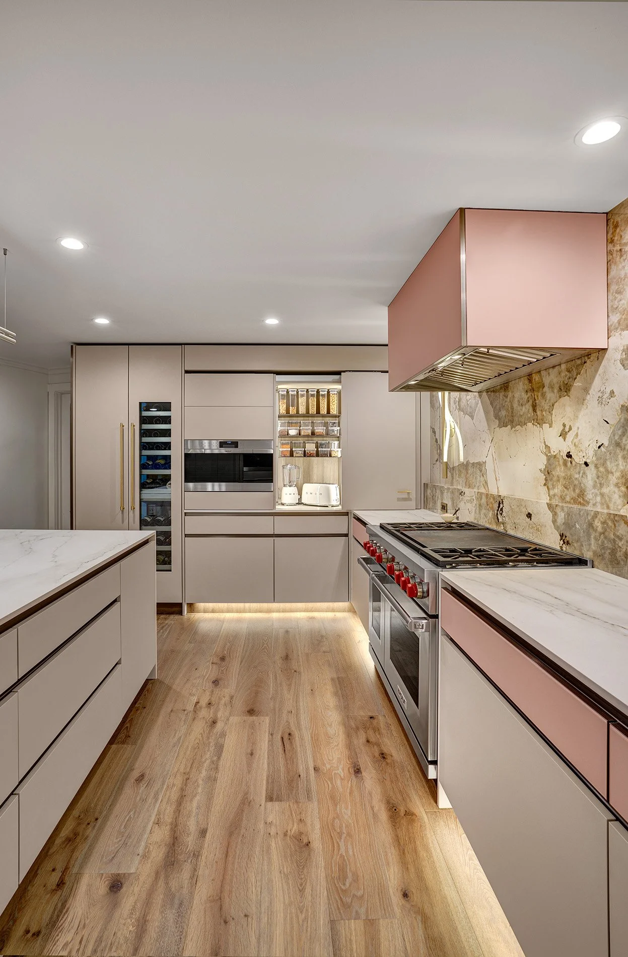 Modern kitchen remodel, blush glass drawer fronts, channel hardware, coplanar cabinet doors, wine refrigerator