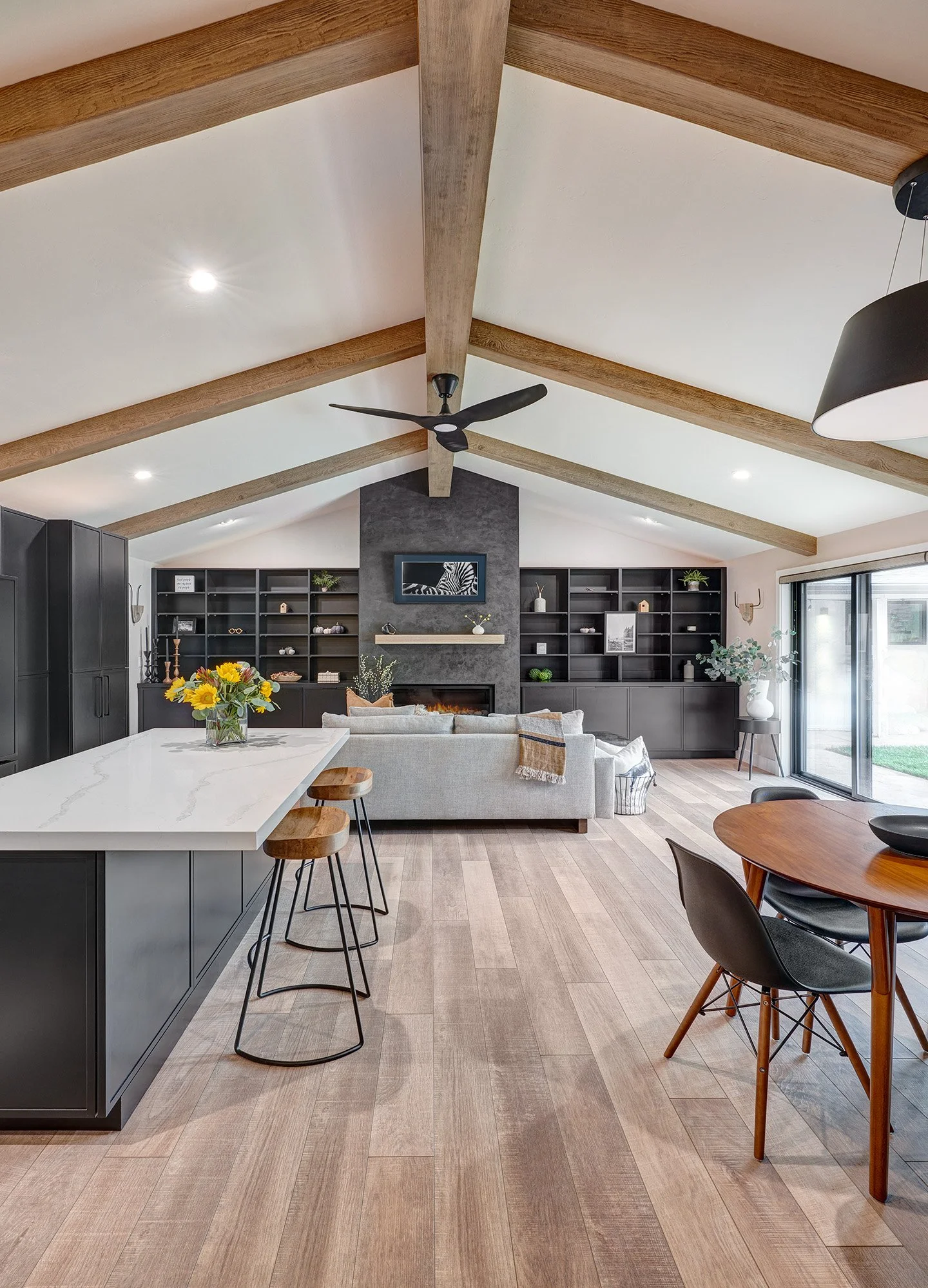 New construction ADU, living room, linear fireplace, Art TV, beams, kitchen island