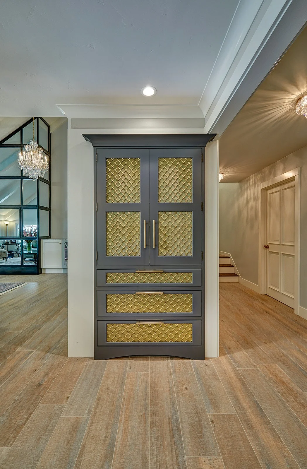 Whole home remodel, built in cabinetry bar, lit interior, metal mesh insert doors