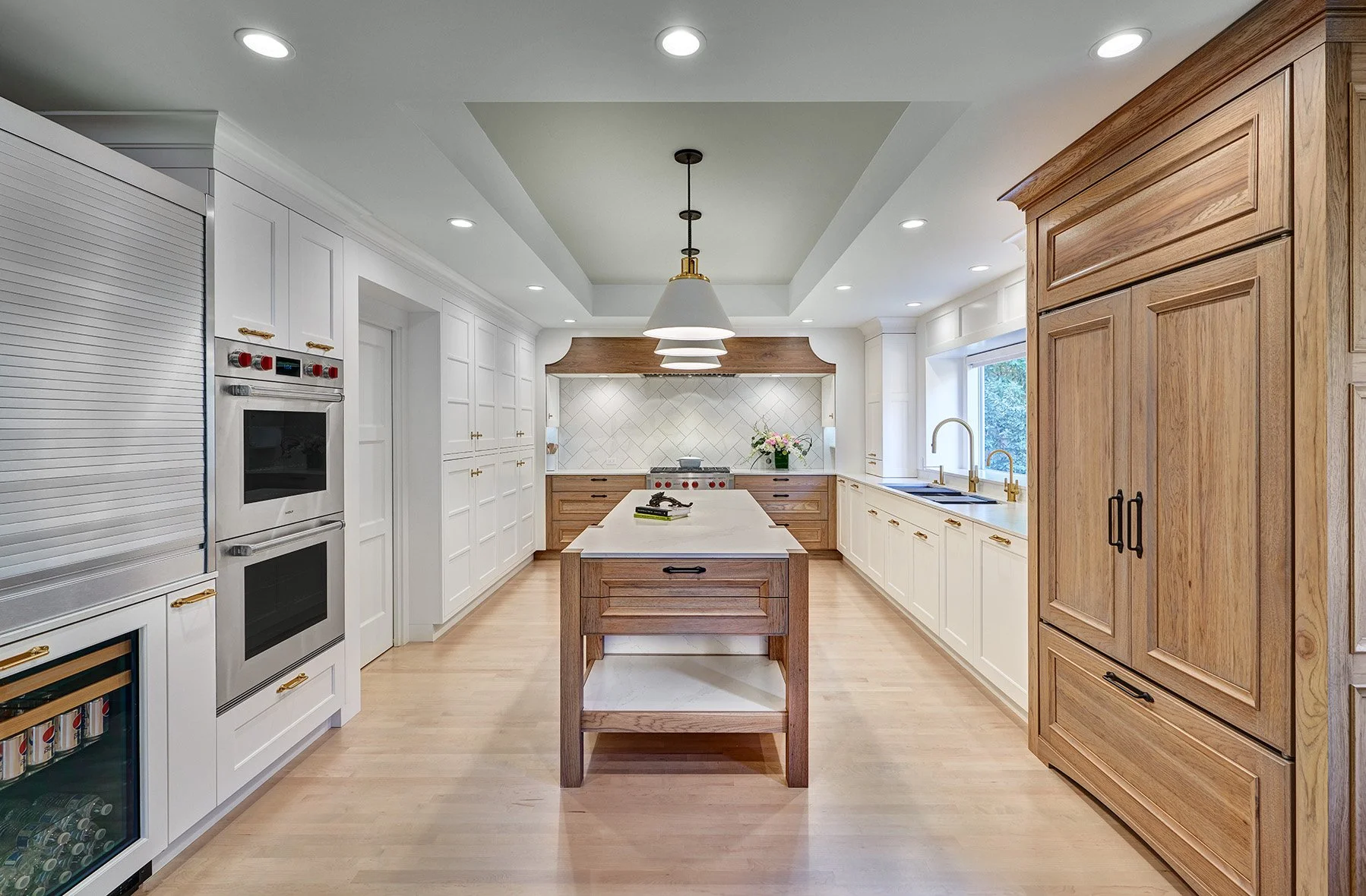 Home remodel, warm contemporary kitchen, hickory and white cabinetry, Sub-Zero Wolf appliances, open legwork island endcap