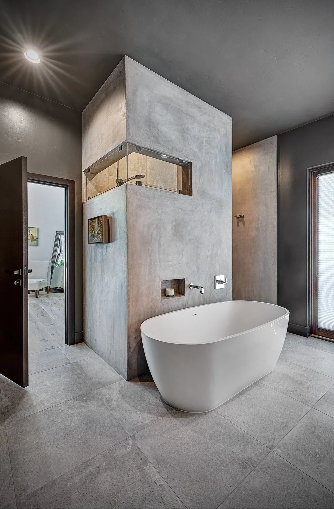 Modern whole home remodel, concrete shower room, freestanding tub, primary bathroom