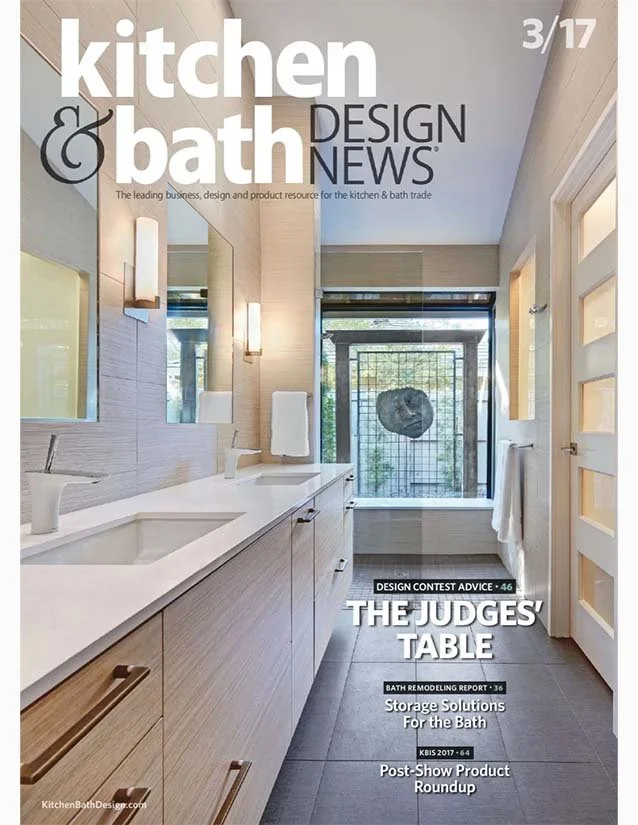 Modern bathroom with double sink vanity, large mirror, light wood cabinetry, and a bathtub window with natural light.