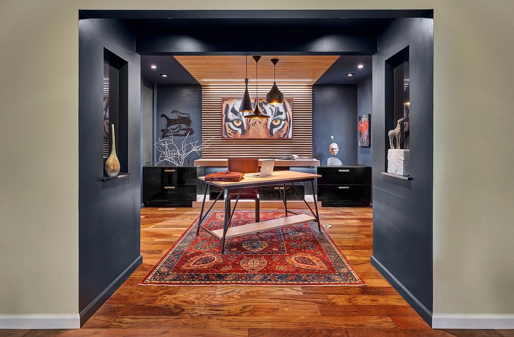 Moody office, gloss black cabinetry, slatted wall treatment, desk