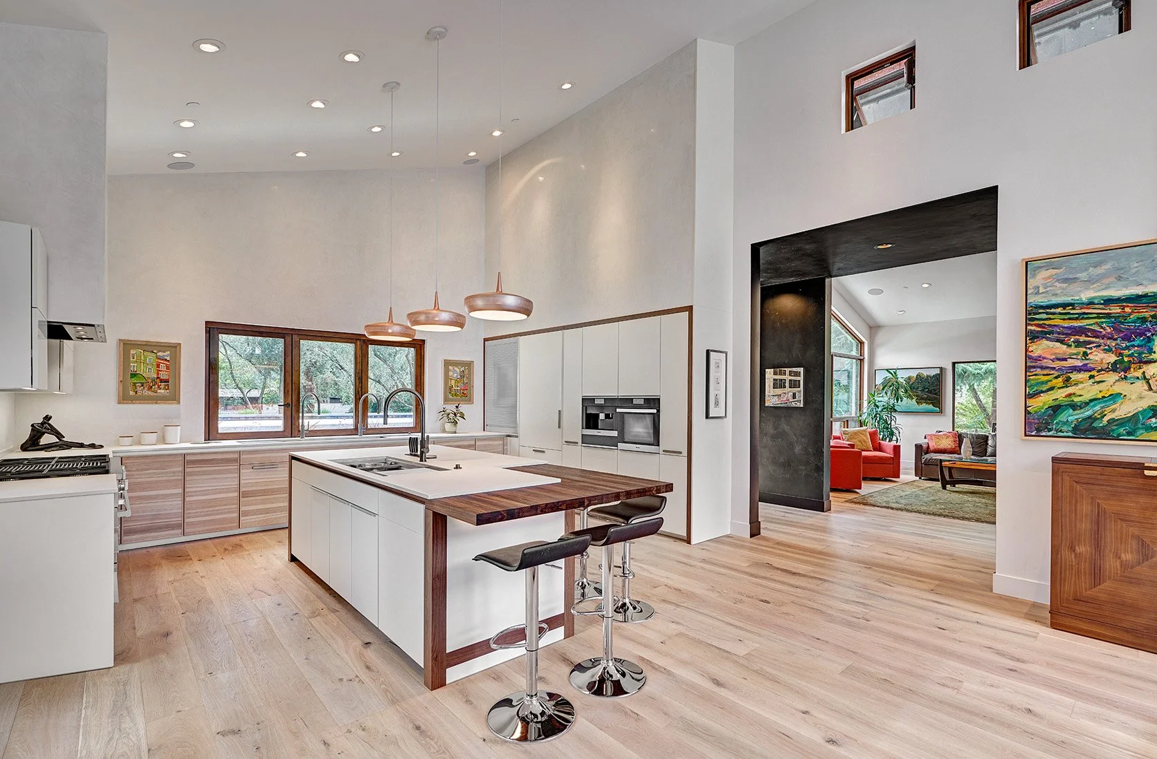 Modern home remodel, vaulted kitchen, wood wrapped appliance wall, seating island