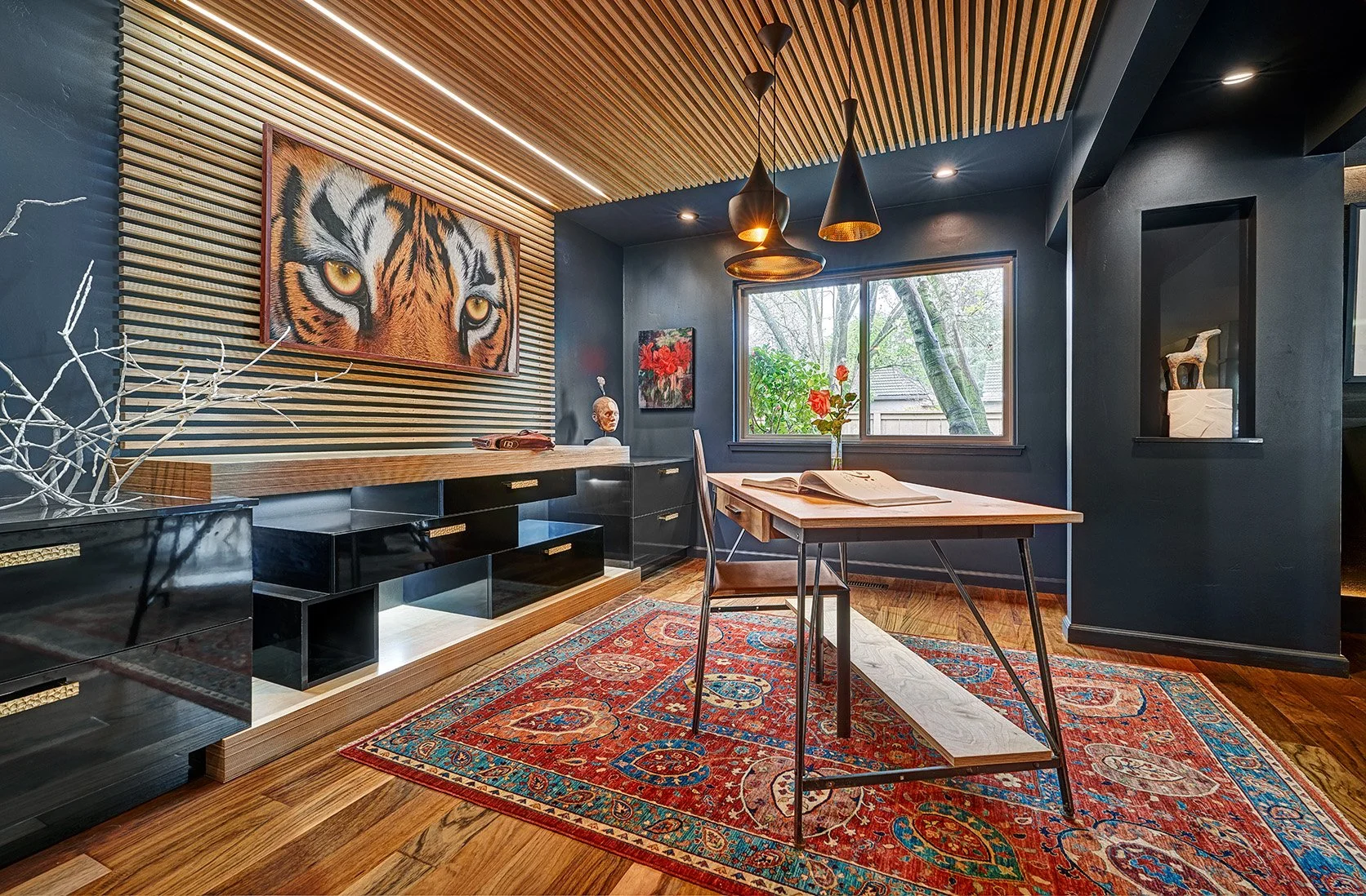 Moody office, gloss black cabinetry, slatted wall treatment, desk