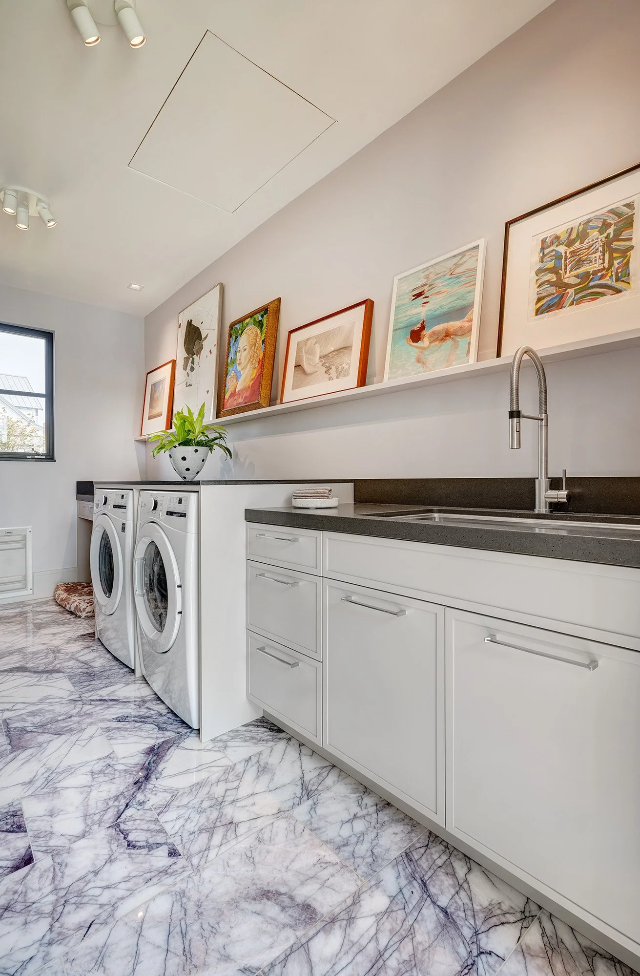 Warm contemporary new construction home, slim shaker cabinet doors, floating art display shelf, laundry room