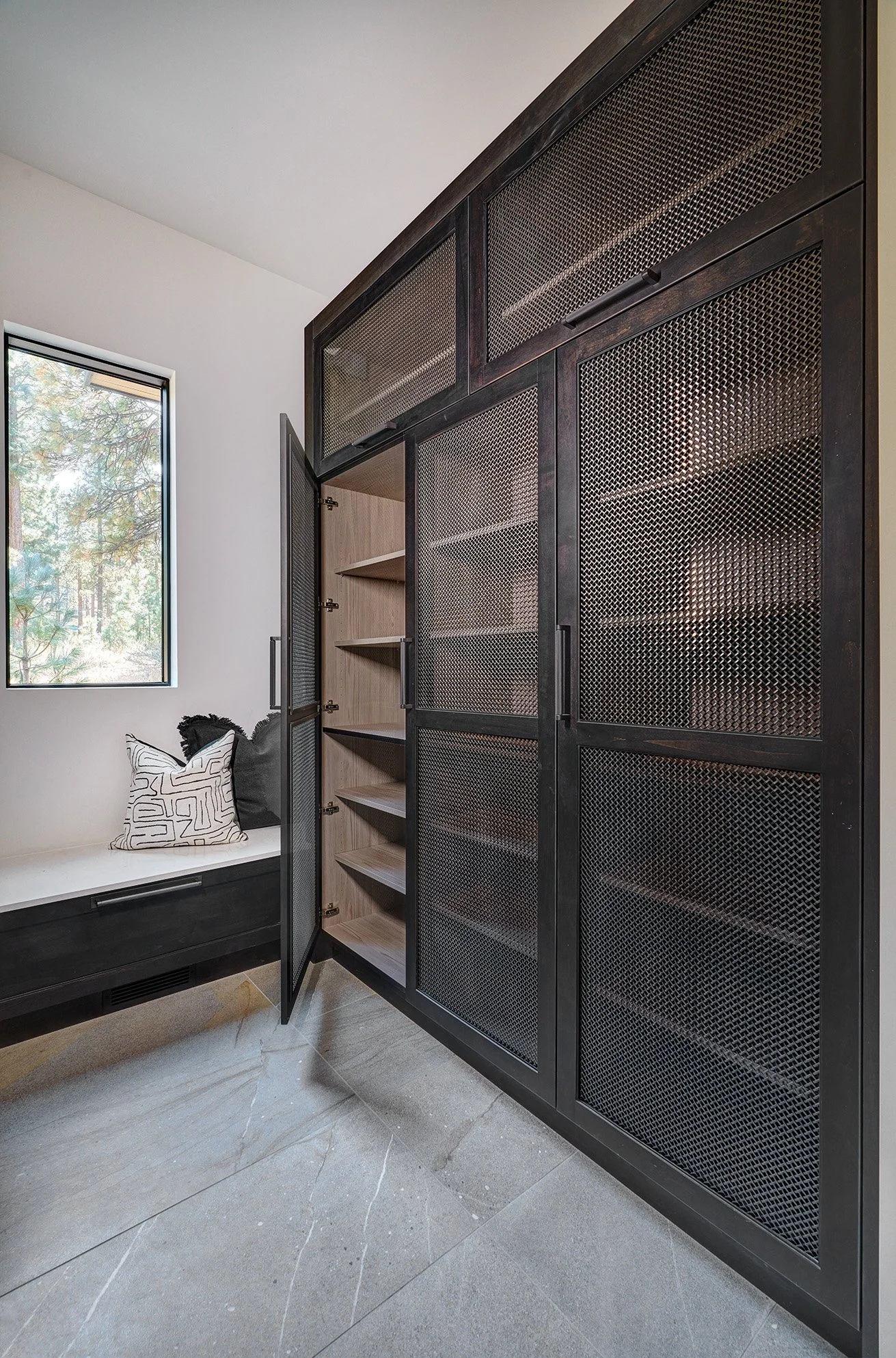Modern new construction home, metal mesh door cabinets, mudroom