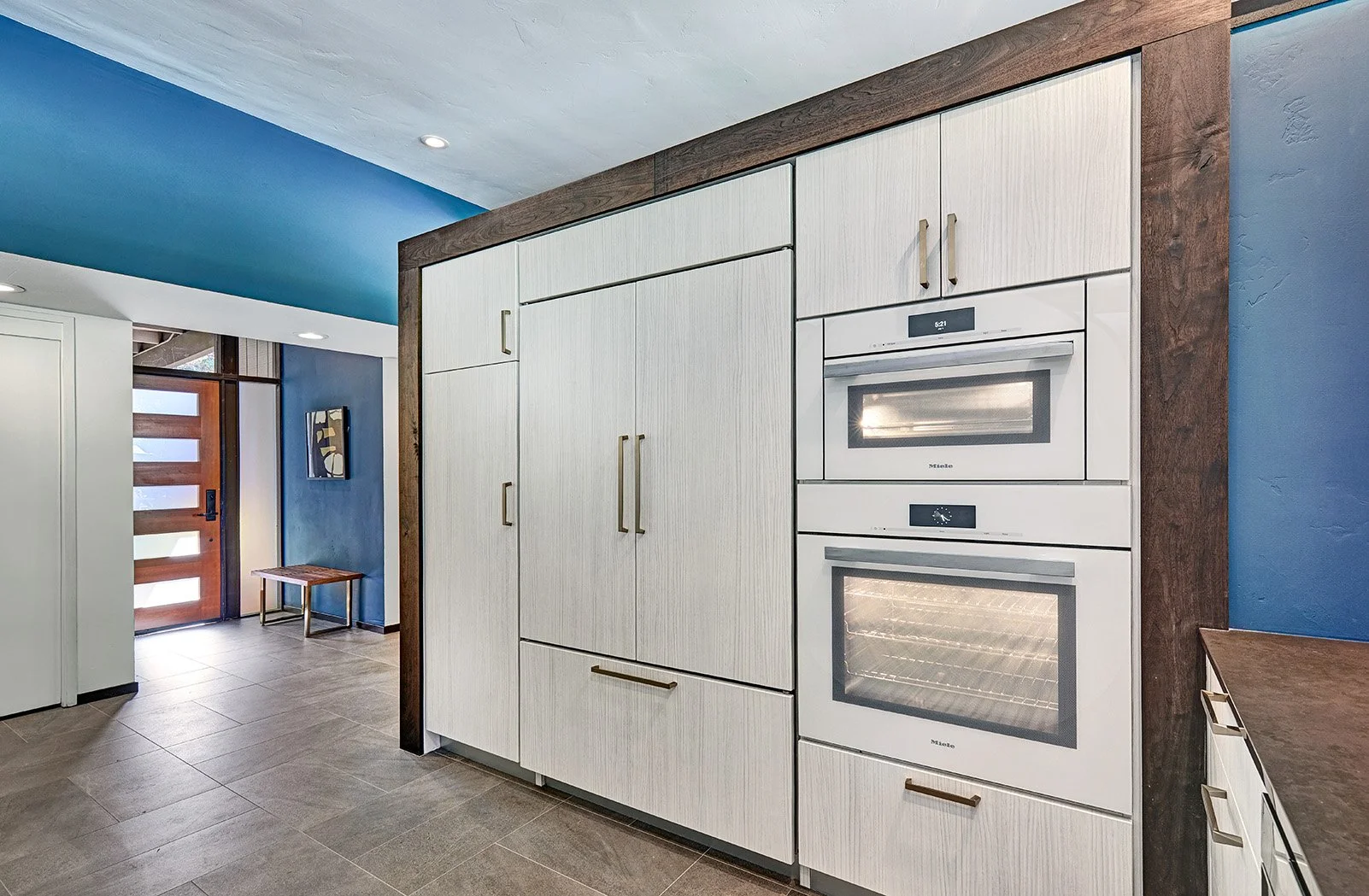 Mid-Century Modern kitchen remodel, Streng home, white + wood cabinetry, waterfall countertop, appliance garage, large island