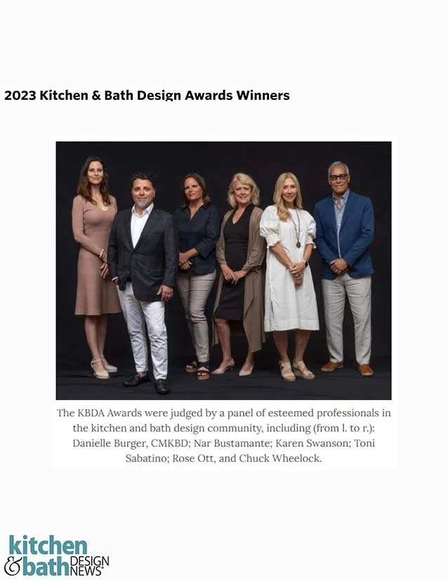 Group of six people standing against a black background, at the 2023 Kitchen & Bath Design Awards