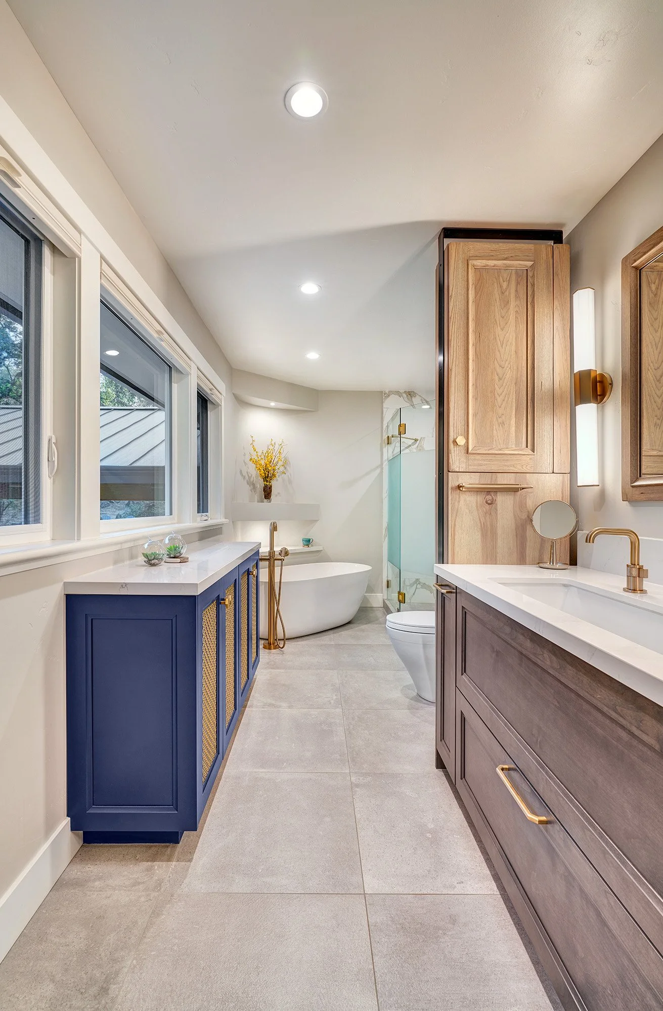 Whole home remodel, modern farmhouse, farmhouse industrial primary bathroom, wood + blue cabinetry, metal mesh, freestanding tub