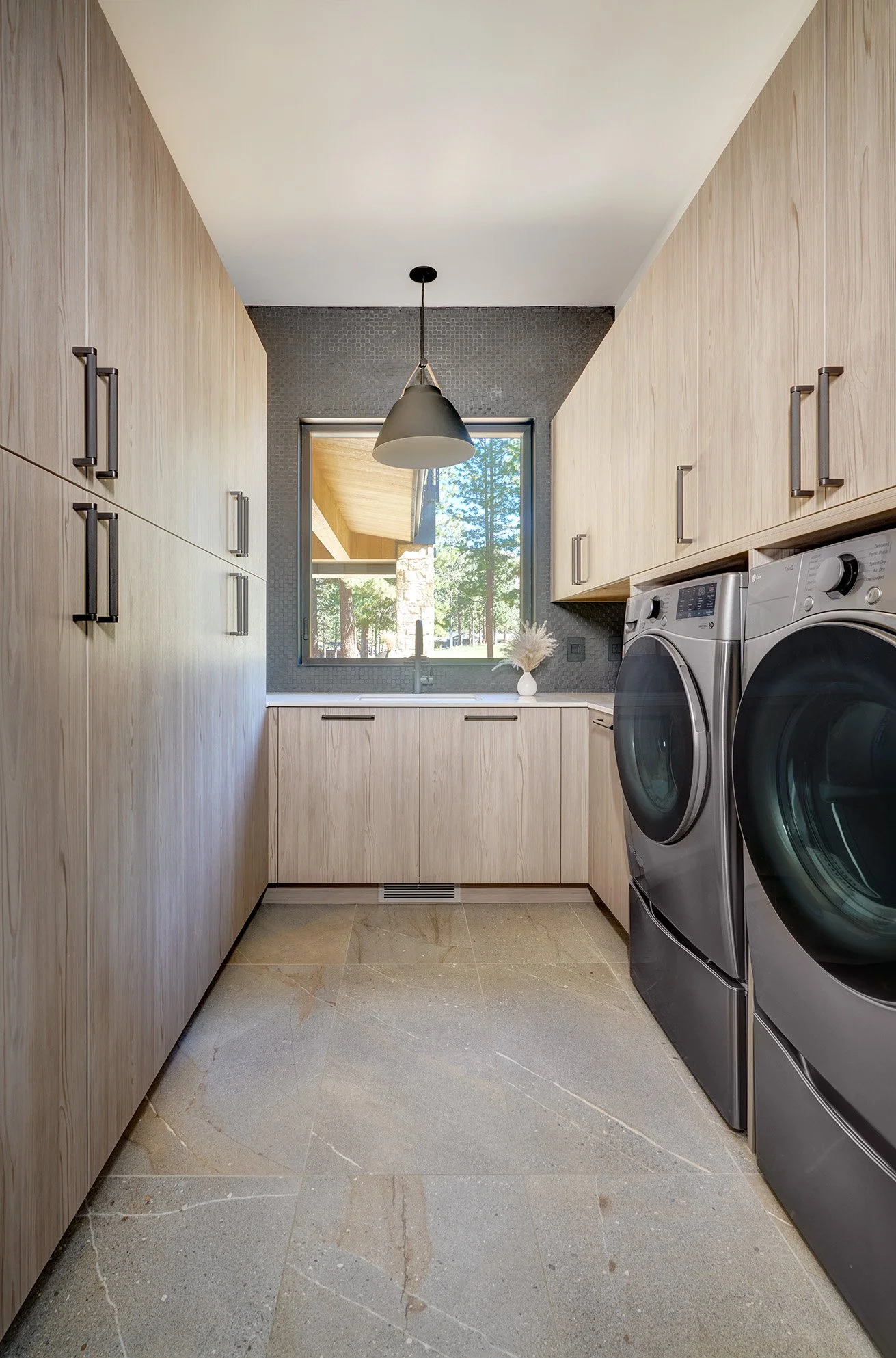 Modern new construction home, European laminate cabinetry, laundry room