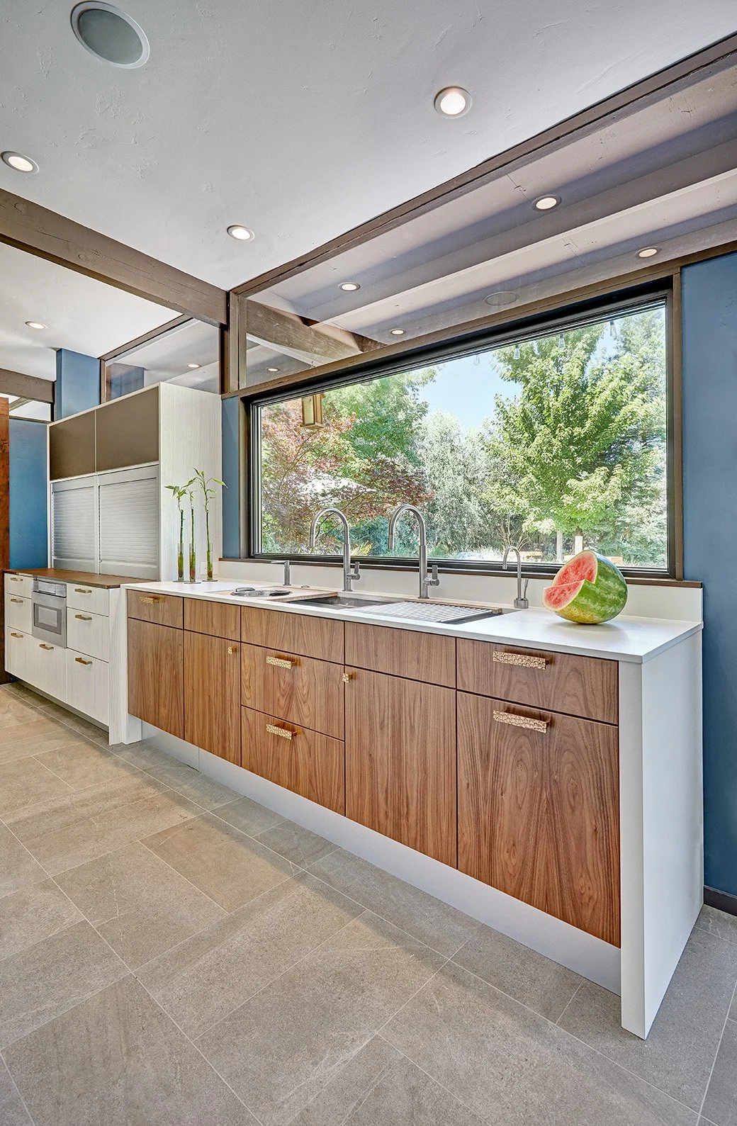 Mid-Century Modern kitchen remodel, Streng home, white + wood cabinetry, waterfall countertop, appliance garage, large island