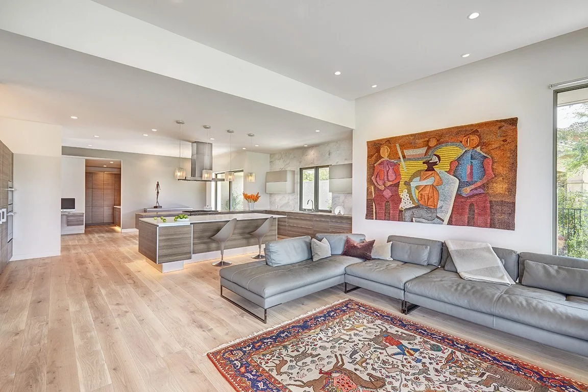 Modern new construction home, European cabinetry, kitchen + living room, large seating island