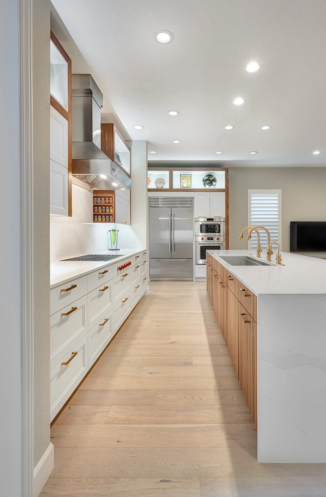 Modern kitchen remodel, white + walnut cabinetry, large seating island, workstation sink