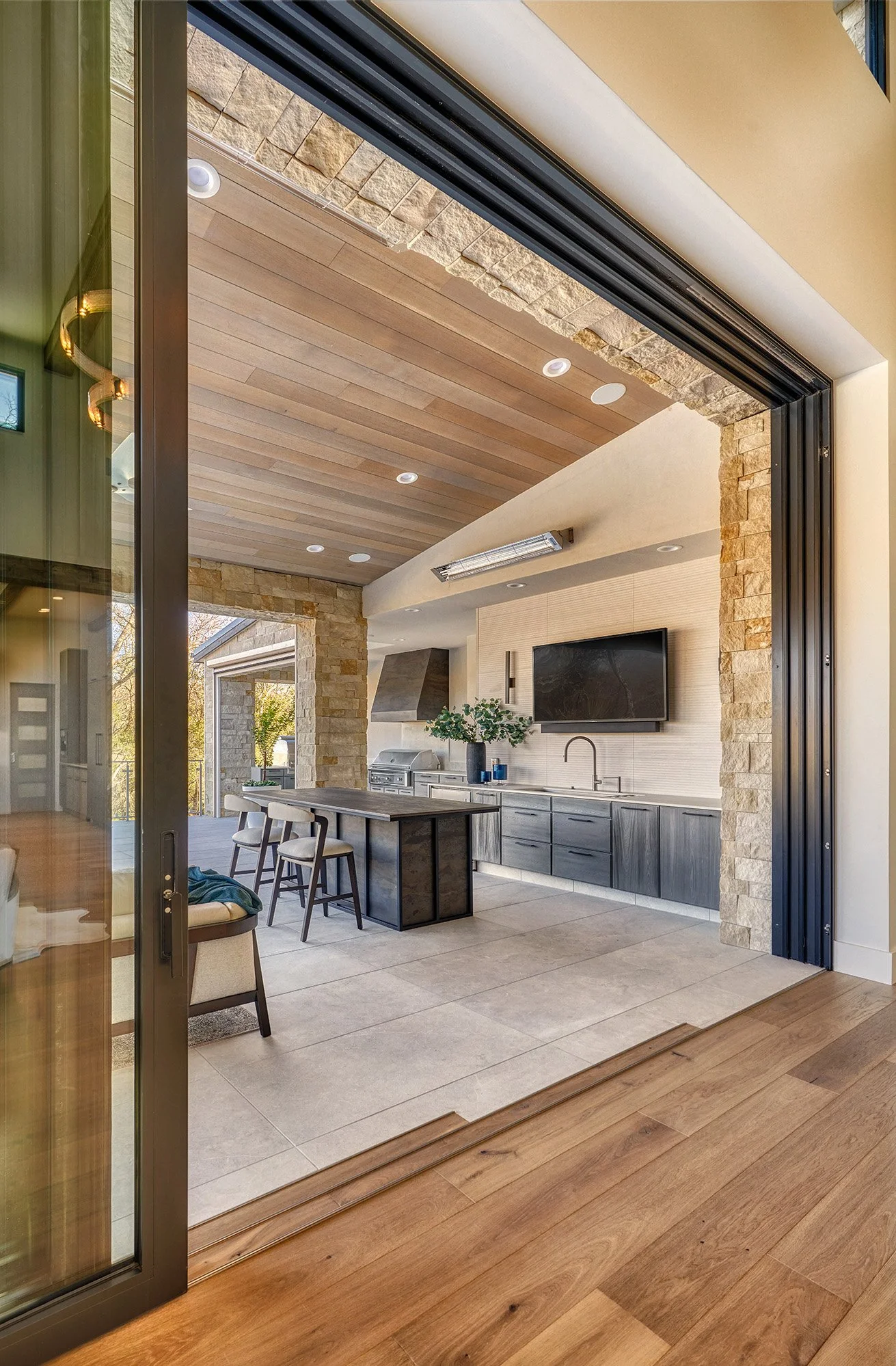 Modern new construction home, outdoor kitchen, large sliding stacking glass doors
