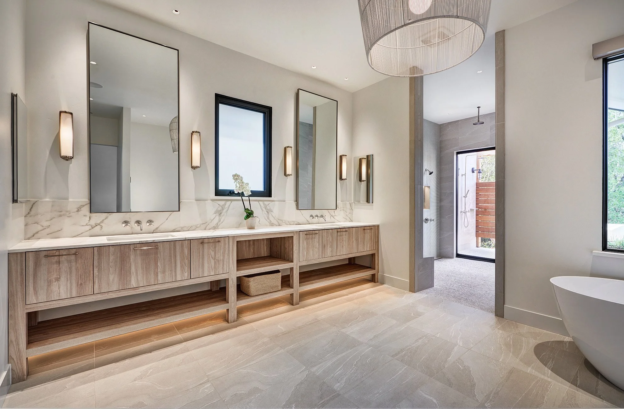 Warm modern new construction home, open legwork vanity cabinet, freestanding bathtub, primary bathroom