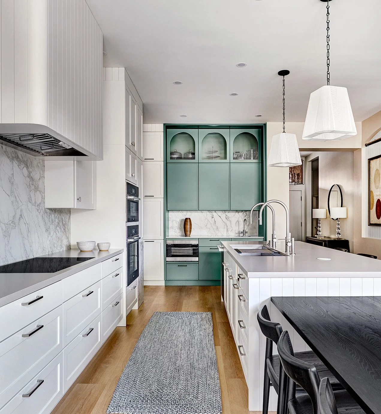 Kitchen with white, wood and green cabinetry. Custom kerf cabinetry accents and a specialized tea station for tea lovers.
