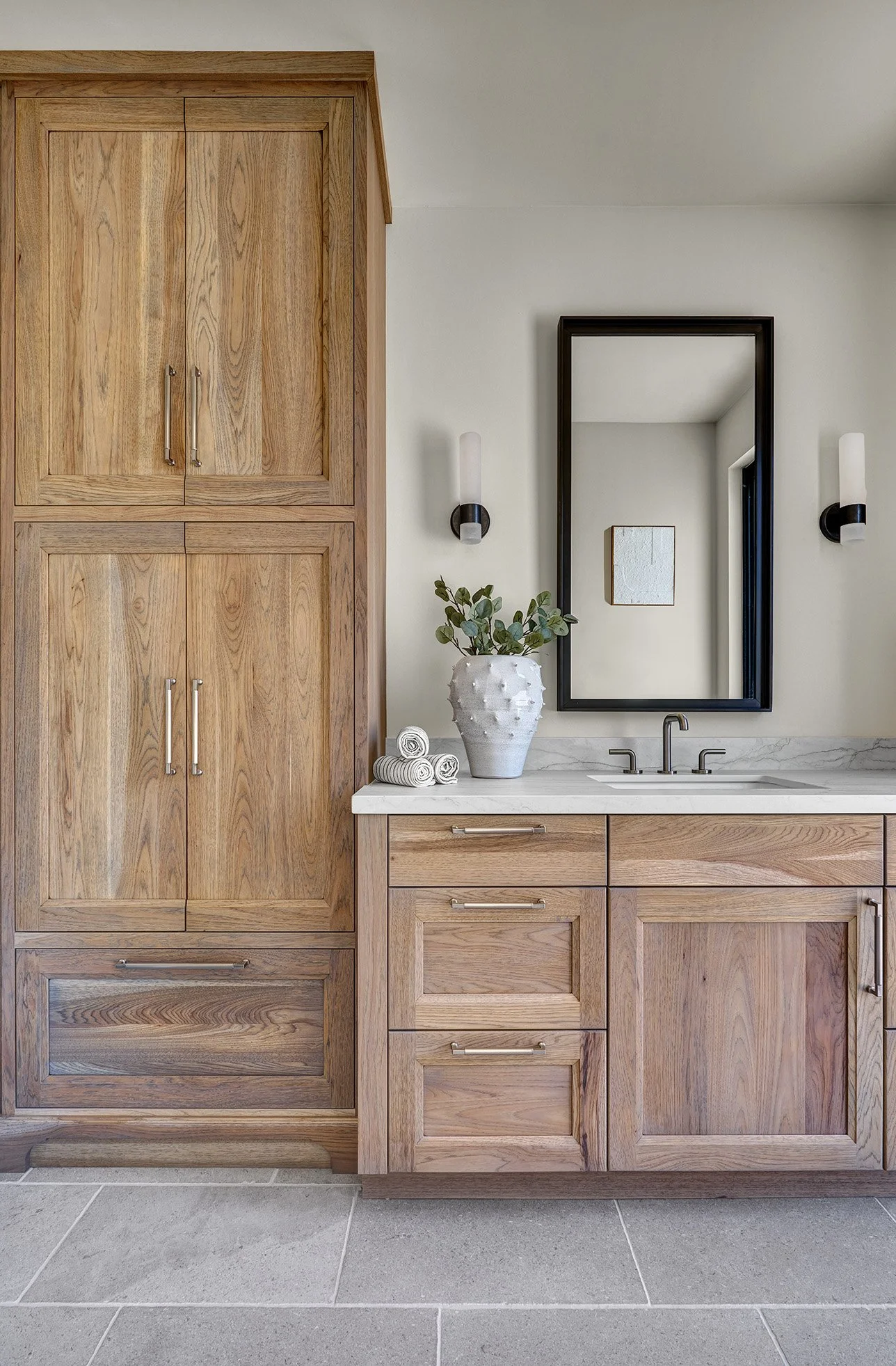 Warm hickory cabinetry, warm clean bath