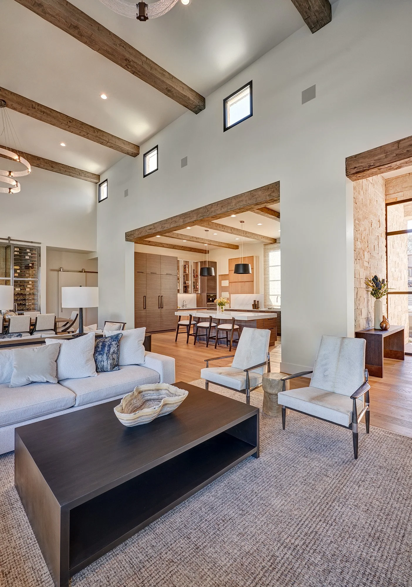 Modern new construction home, living room, tall ceilings, beams