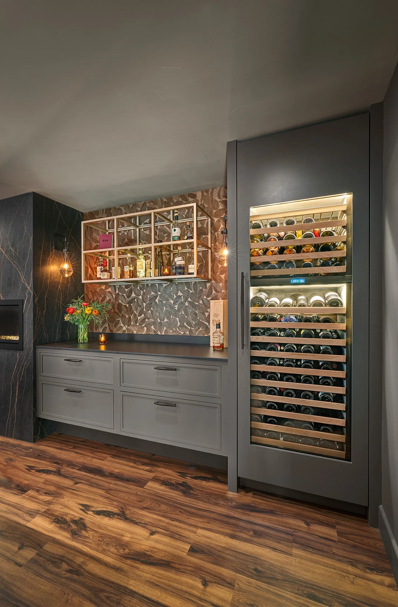 Remodeled dining room, European cabinetry, glass front internally lit display cabinet, paneled wine refrigerator, linear fireplace