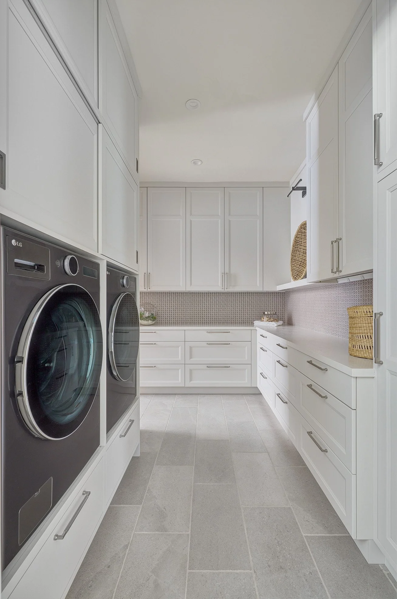 White, shaker style cabinetry, laundry room, clean