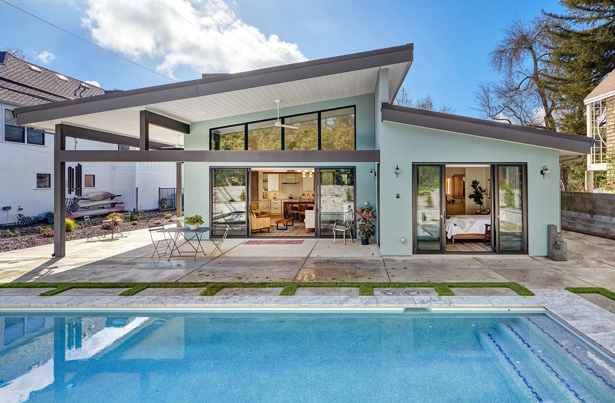 New construction ADU home, raked roof, exterior, pool, patio