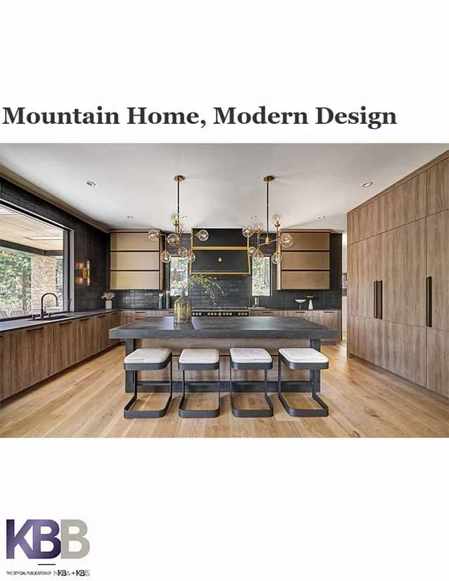 Cover of a modern kitchen design magazine titled 'Mountain Home, Modern Design' featuring a spacious kitchen with wooden cabinets, a large island with seating, black backsplash, and contemporary pendant lighting.